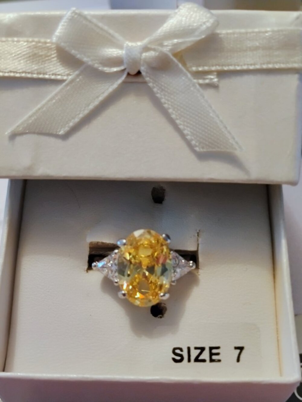 Beautiful Rhodium plated Yellow and white cubic zirconia ring size 7.